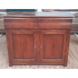 A pitch pine Side Cabinet with two frieze drawers and panel doors, 35" (89cms) h. x 42" (107cms).