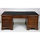 A Georgian style mahogany pedestal Partners Desk, with leather inset top,