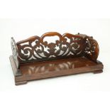 A Victorian rosewood Book Carrier, with pierced decorated fretwork sides,