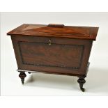A very good mahogany sarcophagus shaped Cellarette, with segmented lead lining,