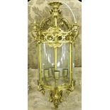 A cylindrical brass and glass Hall Lantern, (O.R.M.) with urn finials and terminal, 27" (69cms) h.