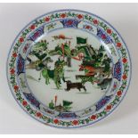 A rare Chinese Famille Verte porcelain Dish, depicting warriors in battle and wild beasts,