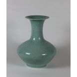 A large Celadon ground Chinese porcelain Vase, with flowers in relief,