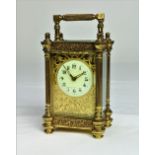 A small French five glass gilt brass Carriage Clock, with ornate pierced scroll work bands,