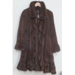 A brown Ladies long Fur Coat, with floral silk lining, as is, w.a.f. S.N.S.R. (1) * C.I.T.E.S.