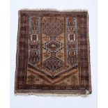 A Baluch Rug, 20th Century, on a brown field with central medallion within a geometric border,