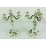 A pair of Meissen three branch Candelabra, with foliate sconces,