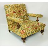 An attractive Irish Victorian Low Armchair, covered in yellow floral brocade,