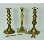 Three antique brass Candlesticks, and a brass Snuffer.