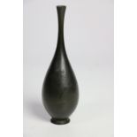 An unusual Archaic type Japanese bronze Vase, (19th Century) with decorative rim, drop handle,