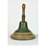 A very large 19th Century bronze Hand Bell, with iron bound oak handle, 21cms (8 1/2") diameter,