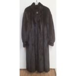 An attractive black Ladies long Fur Coat by "Higgs Furs" Southend,