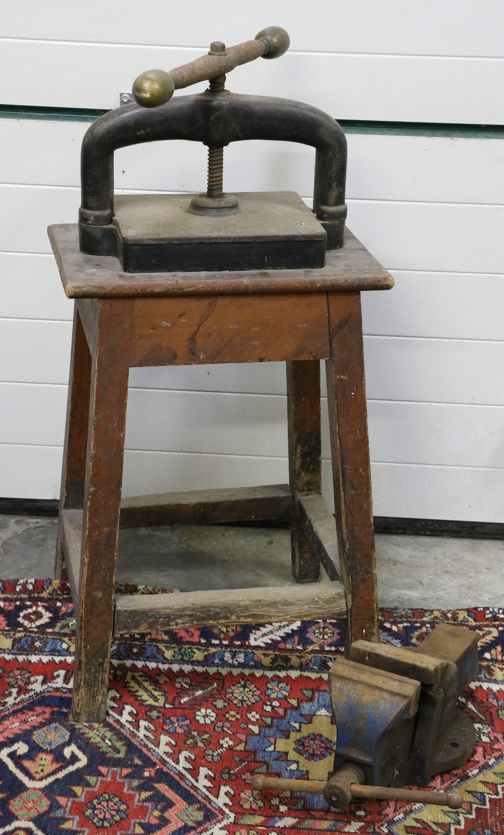 A metal Book Press, on wooden stand, together with Vice.