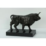 A sculptured bronzed steel Model of a Bull, on marble stand, approx. 7" high.