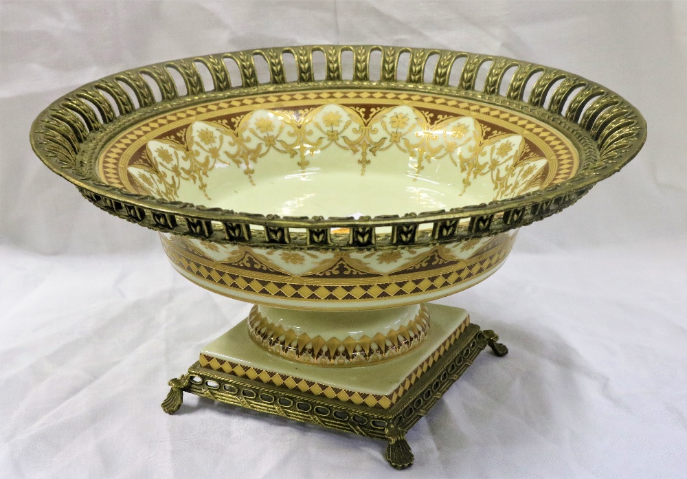 A late 19th Century porcelain and brass decorated Cornucopia,