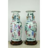 A pair of attractive large 19th Century Cantonese Famille Verte Vases, each decorated with figures,