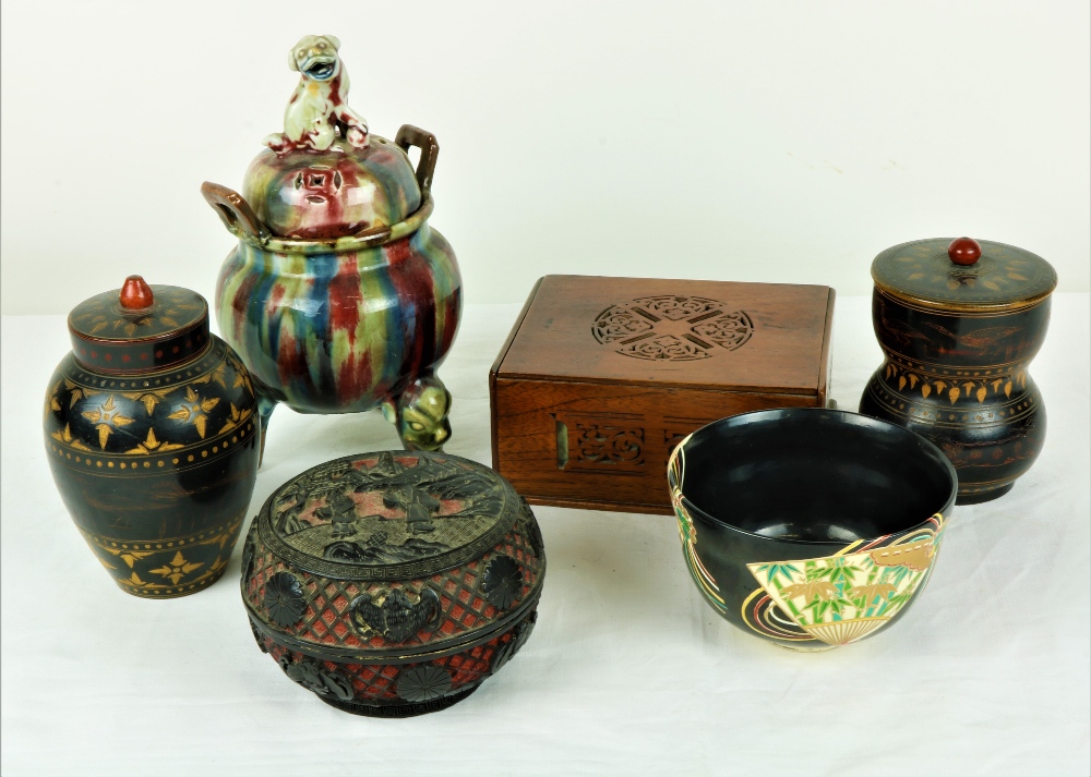 An Oriental glazed Pot Porri Bowl, on three animal legs,