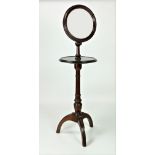 A Victorian mahogany telescopic Shaving Mirror, with circular shelf on tripod pillar support.