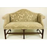 An Irish Georgian style humpback mahogany framed Settee, covered in cream damask,