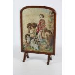 A Victorian walnut framed Firescreen, with central needlework tapestry,