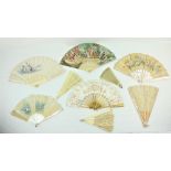 A late 19th Century French painted Fan, depicting two Ladies chatting, with ornate ivory sticks,