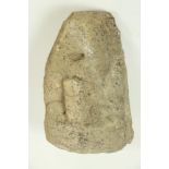 An early Irish carved sandstone Head, of a primitive form with elongated nose and open mouth.