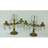 A pair of heavy ormolu two branch Candlesticks or Table Lights, with cutglass drops,