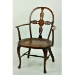 A 19th Century Windsor type Kitchen Chair, with horseshoe shaped seat covered in cane work,