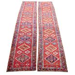 A pair of attractive red ground colourful middle eastern Woollen Carpet Runners,