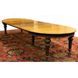 A Victorian Irish mahogany D end Dining Table, in the manner of Strahan, Dublin,