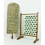 A rare late 19th Century Muslim Teaching Board, with inscriptions both sides, 63cms (24 1/2") long,