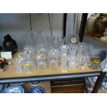 QUANTITY OF ASSORTED GLASSWARE INCLUDING VASES, DECANTERS, CLOCK, BELLS ETC