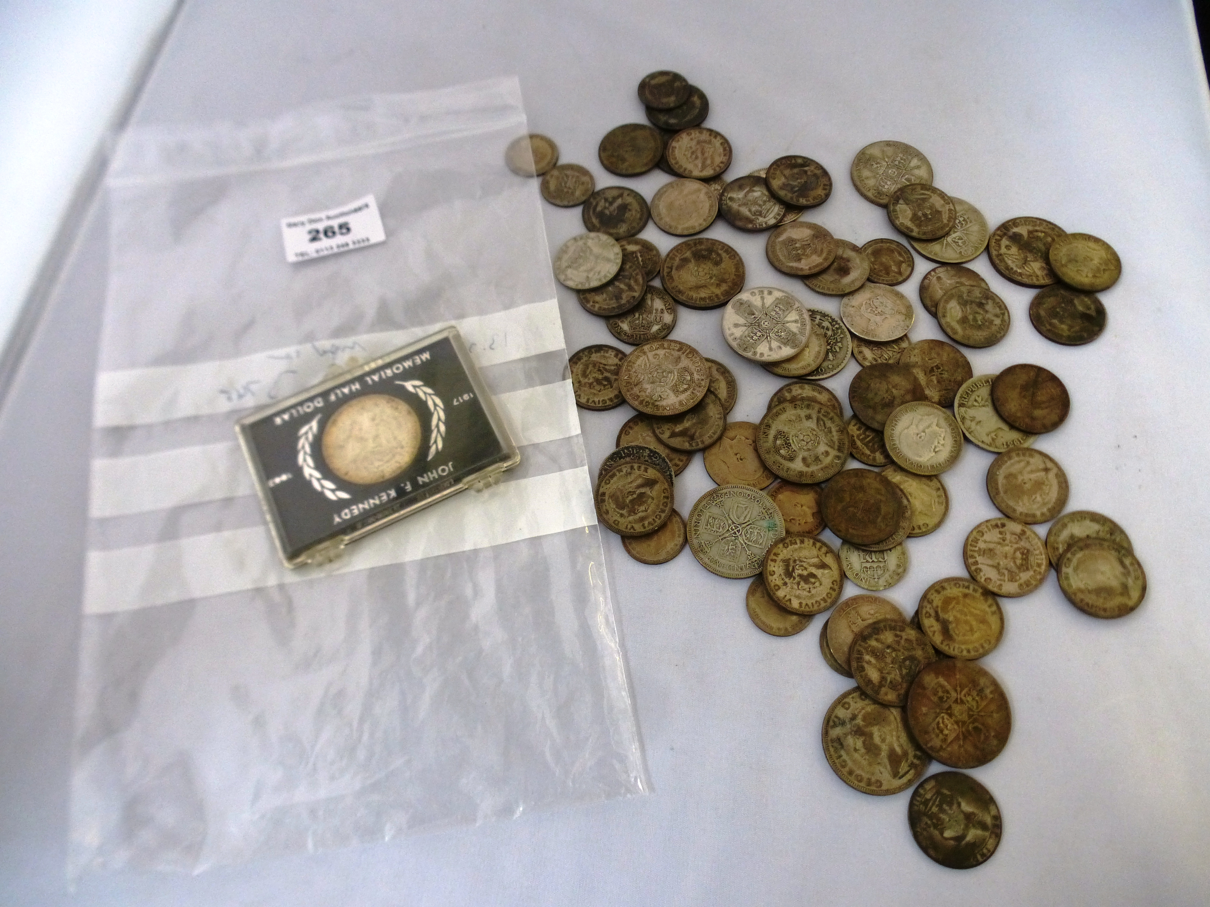BAG OF ASSORTED SILVER COINS INCLUDING UK AND MEMORIAL HALF DOLLAR APPROX W: 13.3 OZT
