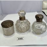 Cut glass scent bottle with silver neck band, cut glass scent bottle with silver top and band, and