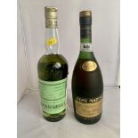 Bottle of Remy Martin Cognac and bottle of Chartreuse French Liquor