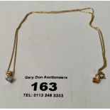 9k gold necklace with diamond pendant, total w: 1.86 grams, length of chain 18”