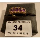 9k gold ring with purple stones, w: 3.78 grams, size O