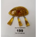 Baltic amber brooch w: 17.8 grams, length 2.5”