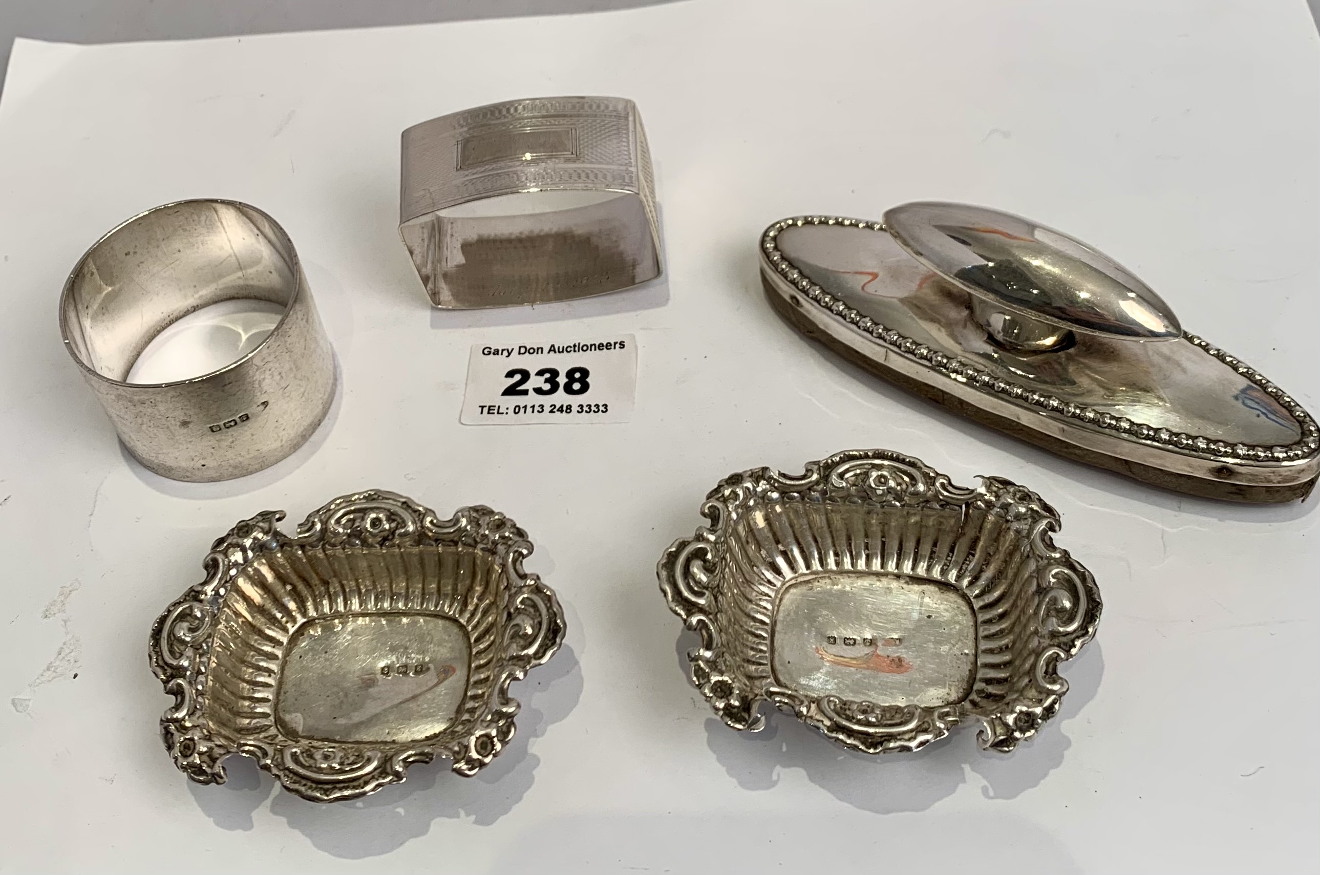 2 silver salt dishes, 2 silver napkin rings and silver topped blotter, total w: 4.1 ozt