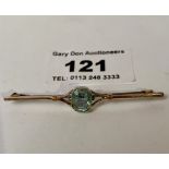 9k gold tiepin with light blue stone, w: 2.29 grams, length 2”