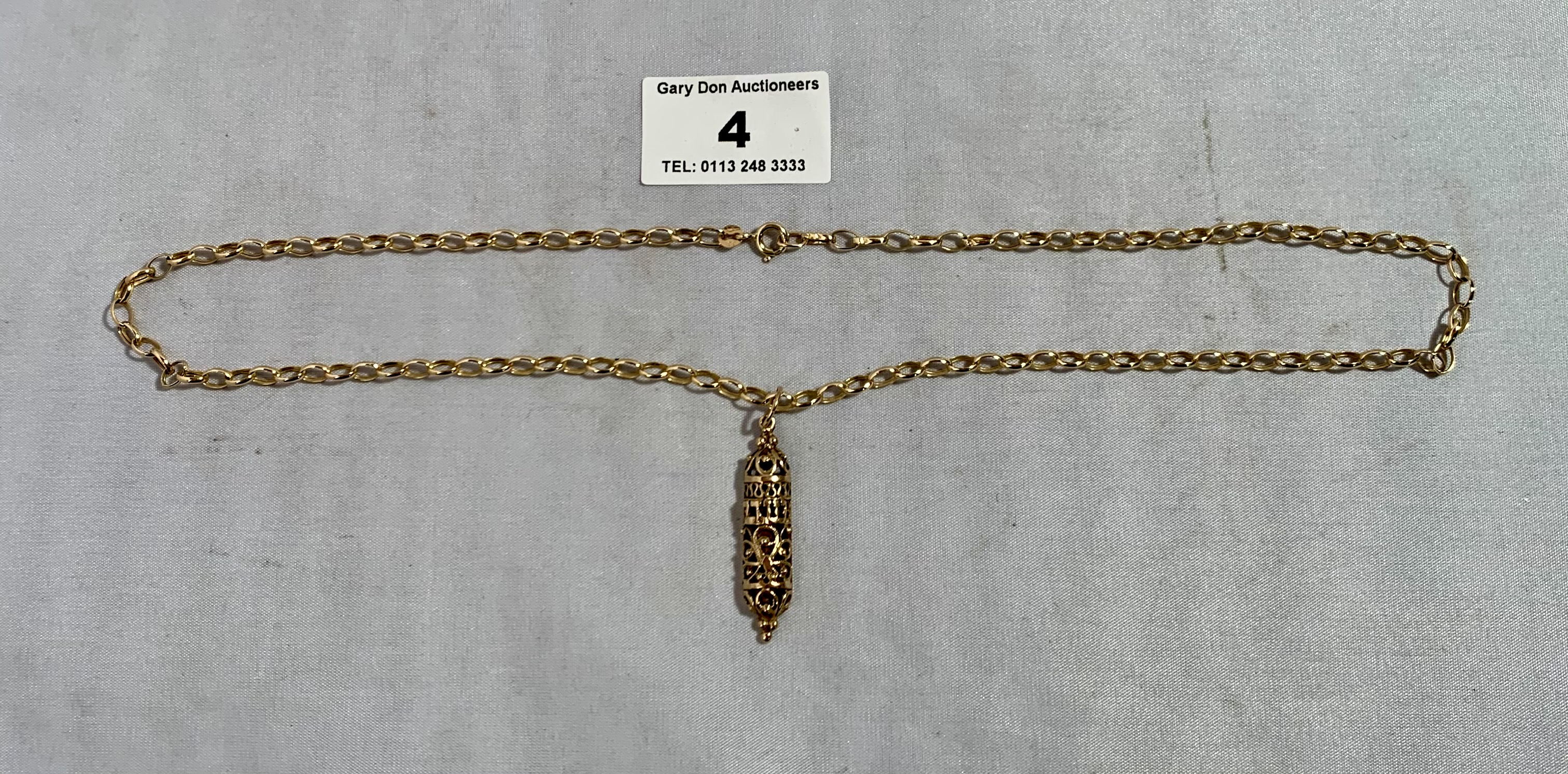 9k gold chain and pendant, w: 6.25 grams, length 20” chain, 1.25” pendant