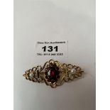 9K gold garnet and pearl brooch, w: 5.68 grams, length 2”