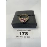 9k gold ring wth diamond and pink stones, w:2.74 grams, size O