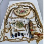 Assorted dress jewellery including chains, brooches, earrings and compact