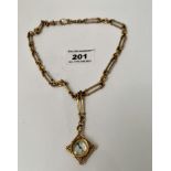 9k gold compass on plated chain, length of chain 18”