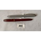 2 “The Champion, A Cotswold Product” fountain pens, the red one with 18k gold plated nib and the