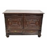 18th century oak moulded low cupboard, the moulded top over two carved panelled cupboard doors and