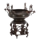 Burmese bronze incense burner, reputedly mid 18th Century, raised on a stand of six stylised