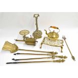 Assorted metalware to include a brass fireside tool trio, a further fire fork, a clockwork