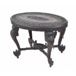 19th century Anglo Indian oval hardwood ebonised occasional table, the top carved with a central